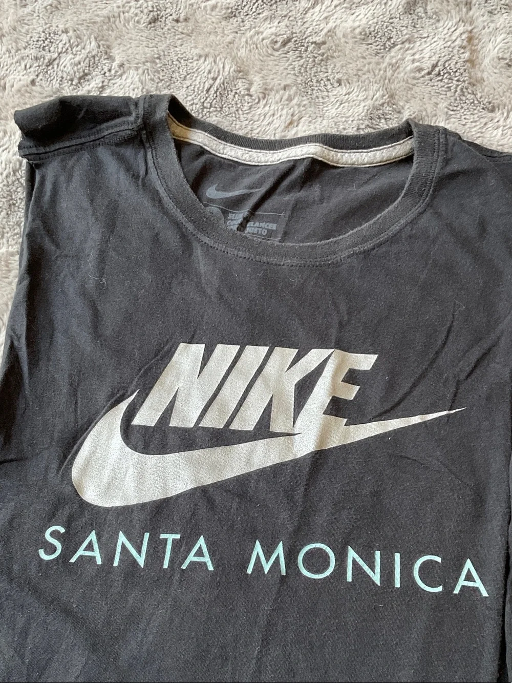 Nike Black Muscle Tank with White Logo and 'Santa Monica' Text